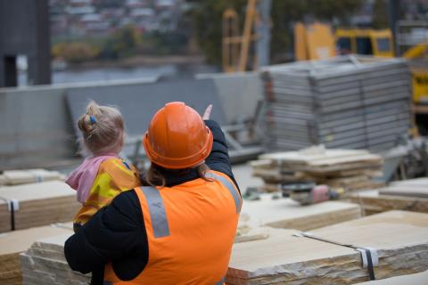 Woman and child on building site
