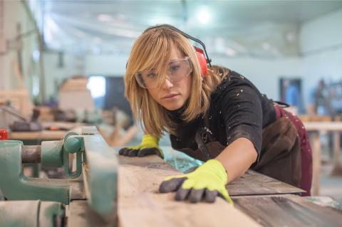 Female Carpenter with Sander